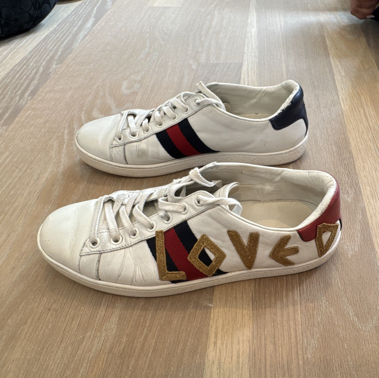 Gucci Women’s Ace Sneaker (LOVED). 37.5 but fits like a women’s size 9.