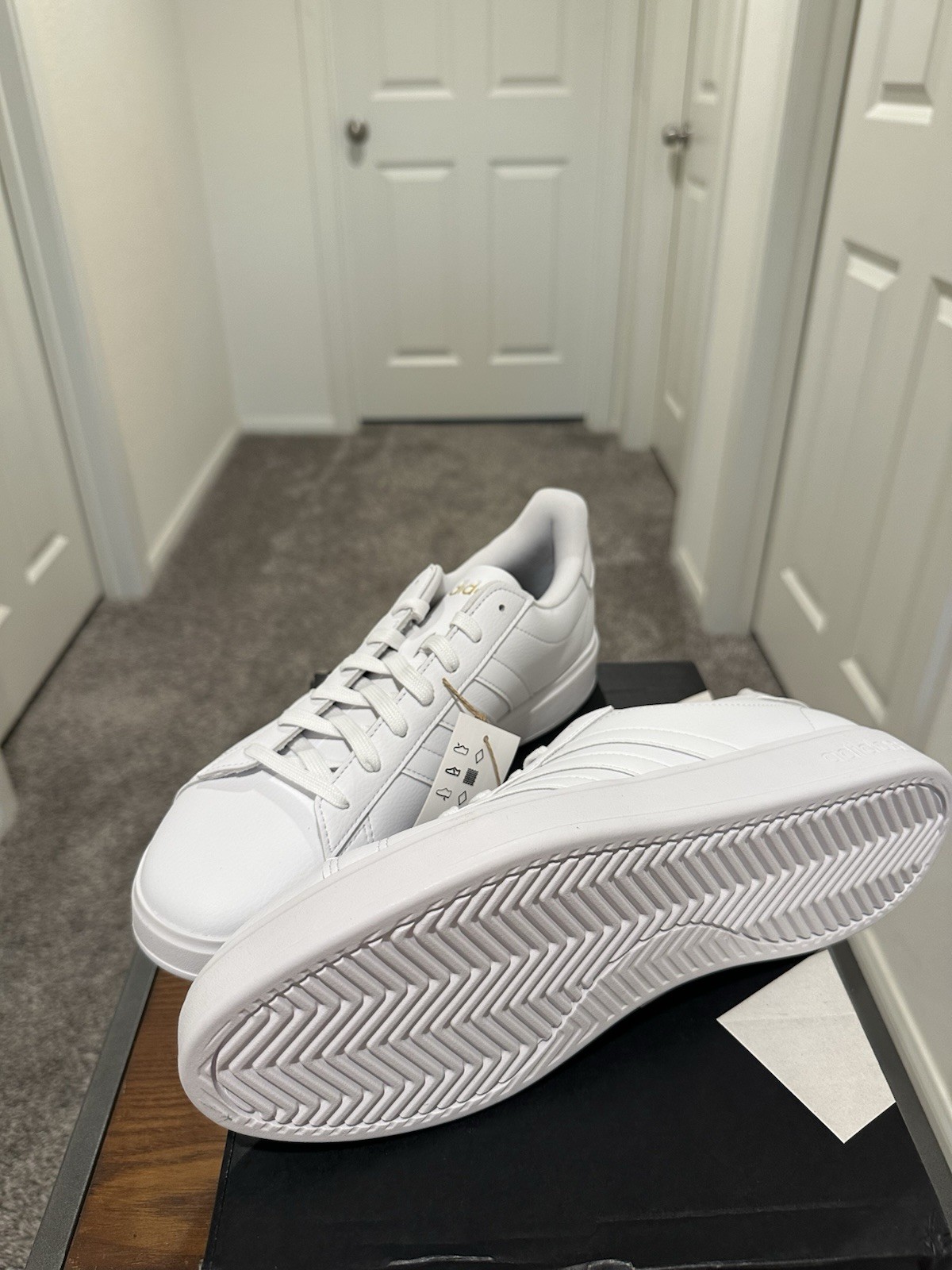 Adidas Grand Court 2.0 in a white colorway with gold lettering. Women’s 11. ￼