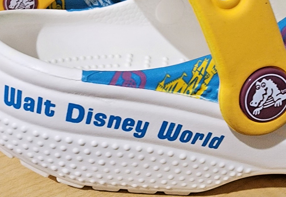 Crocs size M5 W7 blue white yellow pink clogs with Walt Disney World castle