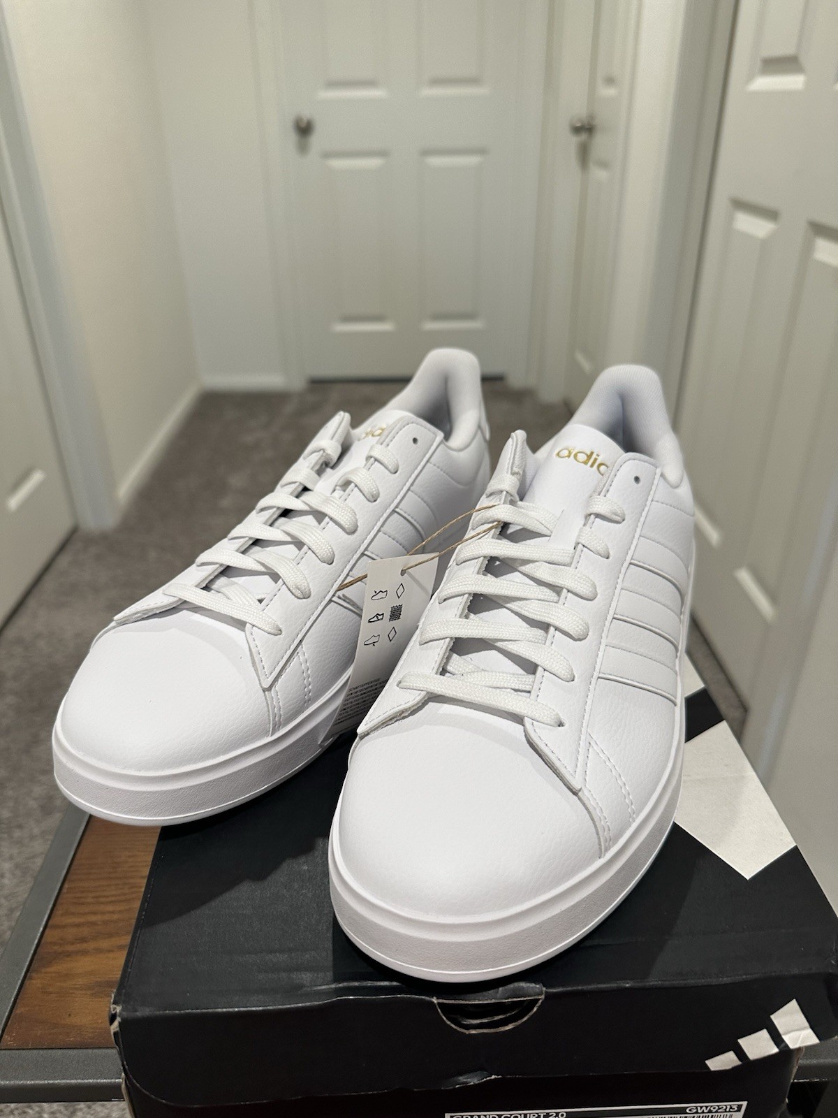 Adidas Grand Court 2.0 in a white colorway with gold lettering. Women’s 11. ￼
