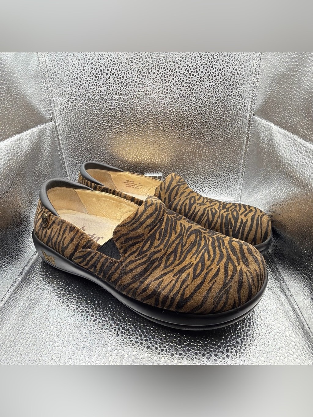 Alegria Slip-On Zebra-Print Loafers in Brown and Black