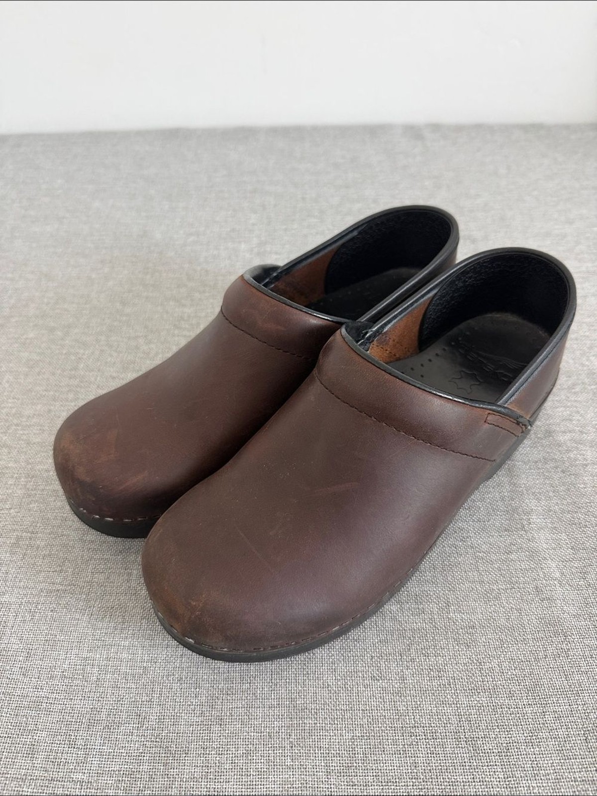 Dansko Brown Leather Slip-On Clogs with Black Trim