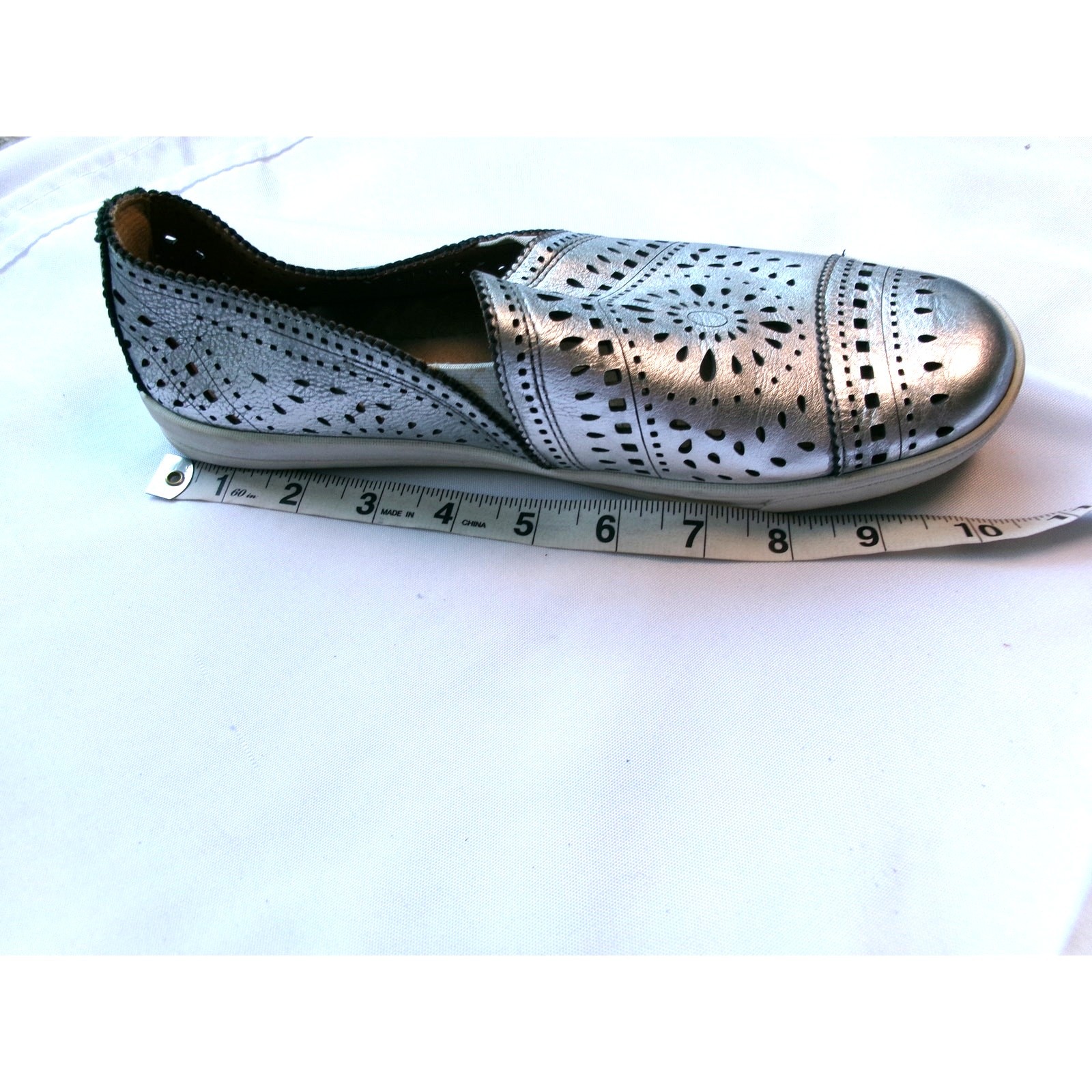 Earth Tangelo Silver Metallic Laser Cut Slip On Sneakers Women’s
