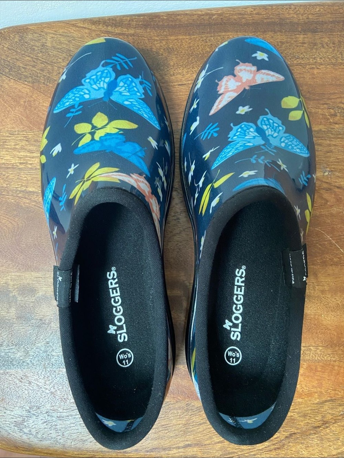Sloggers Floral Butterfly Slip-On Clogs – Navy with Blue, Yellow & Coral Accents