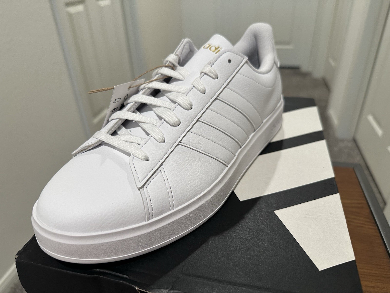 Adidas Grand Court 2.0 in a white colorway with gold lettering. Women’s 11. ￼